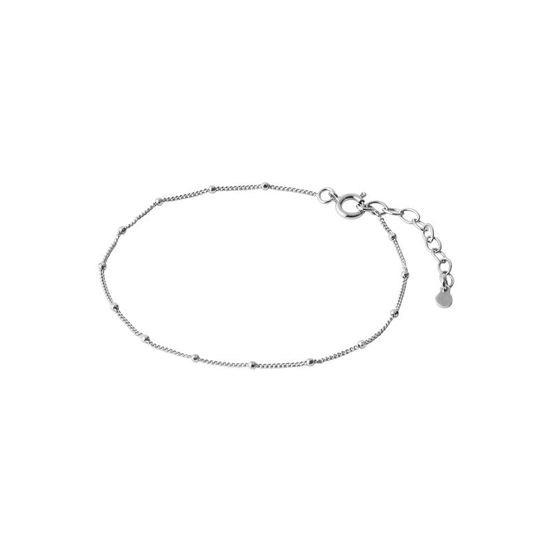 Caia armbånd i sølv med forgyldte kugler fra Pernille Corydon – justerbart 16–19 cm.